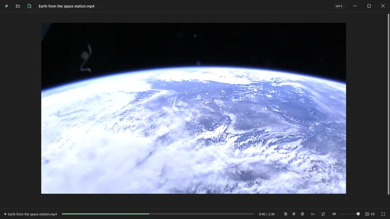 A film of the Earth from orbit, playing.